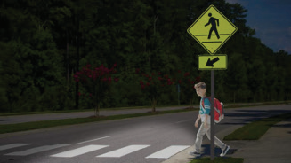 DLP 前照灯醒目地照亮了一个试图横穿马路的儿童， 同时使人行横道标志变暗以减少眩光。